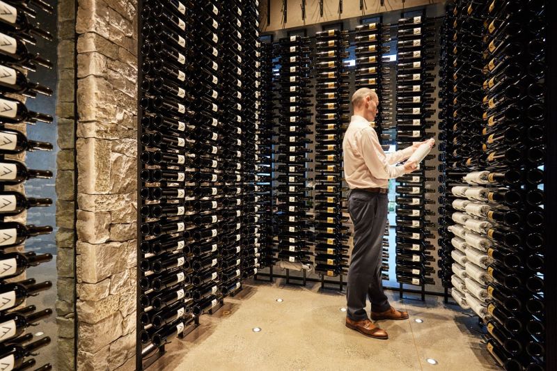 Seven Apart Wine Bottles on Shelves in the Tasting Room